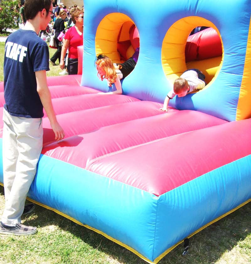 photo of children playing on a bounce house